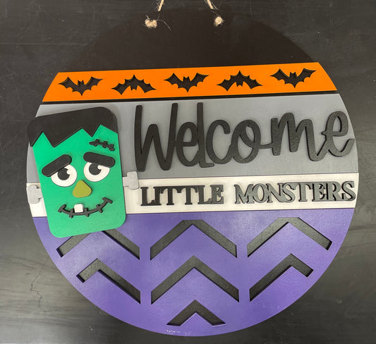 Welcome Little Monsters Round Sign